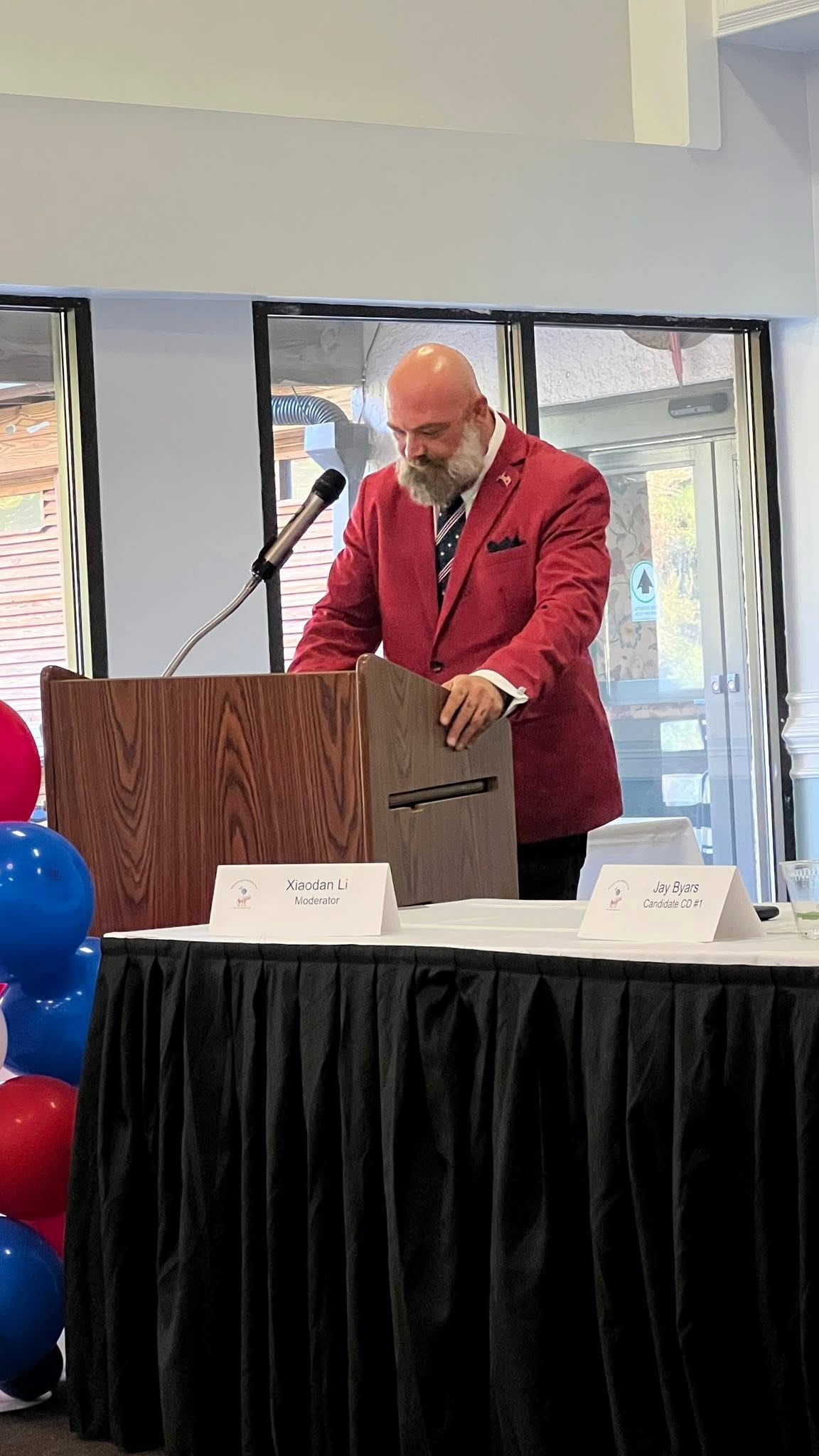 Justin Myers moderating a civic event
