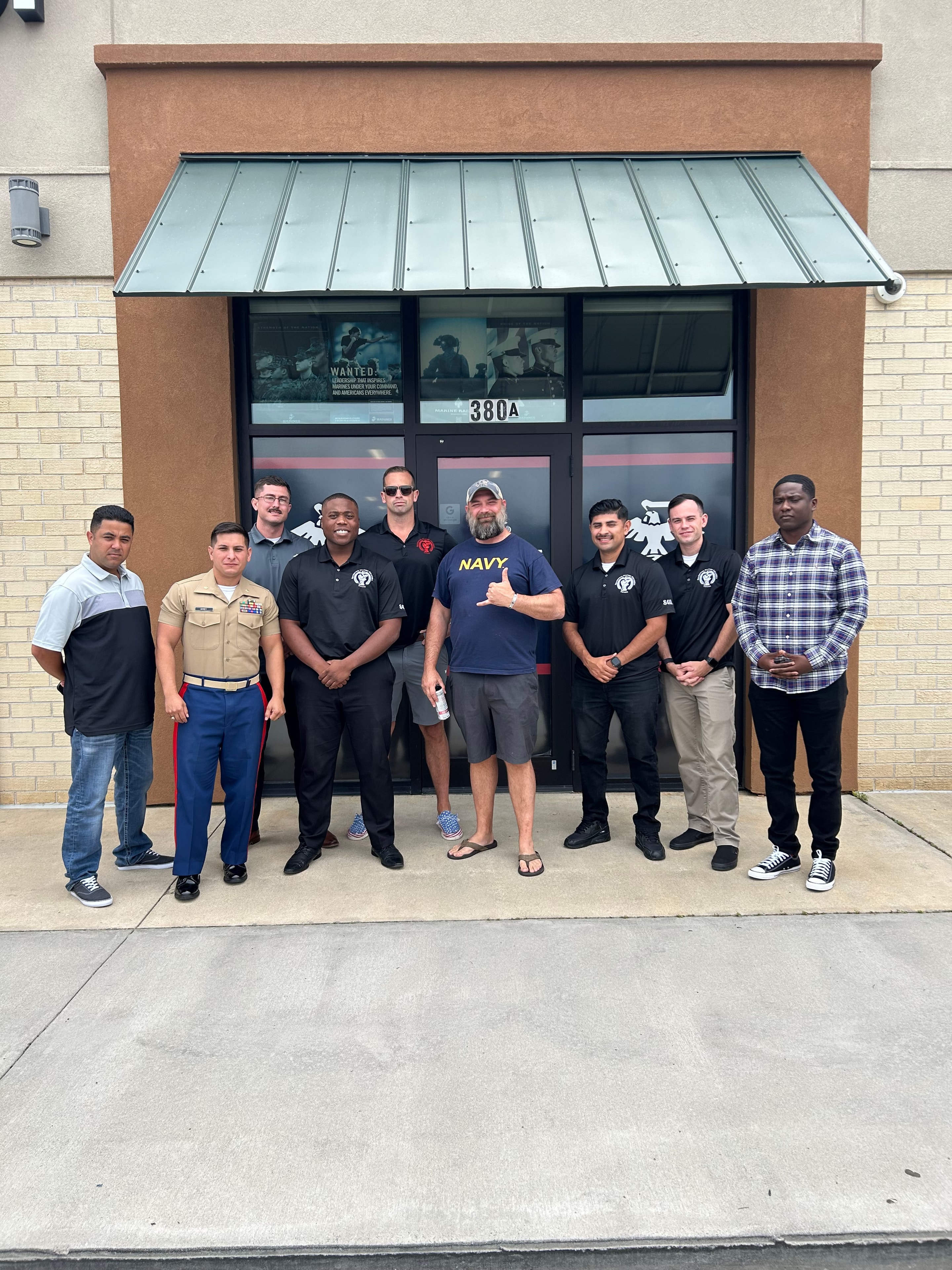 Justin Myers with a group at a storefront event
