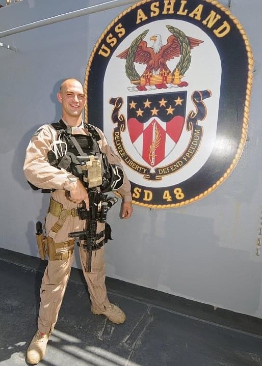 Justin Myers — Navy veteran in uniform aboard USS Ashland